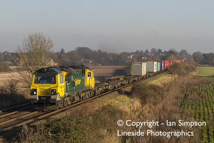 Freightliner Class 70 70016 climbs away from Thurston with the diverted 4M87 11.13 Felixstowe to Trafford Park on Wednesday 28th December.